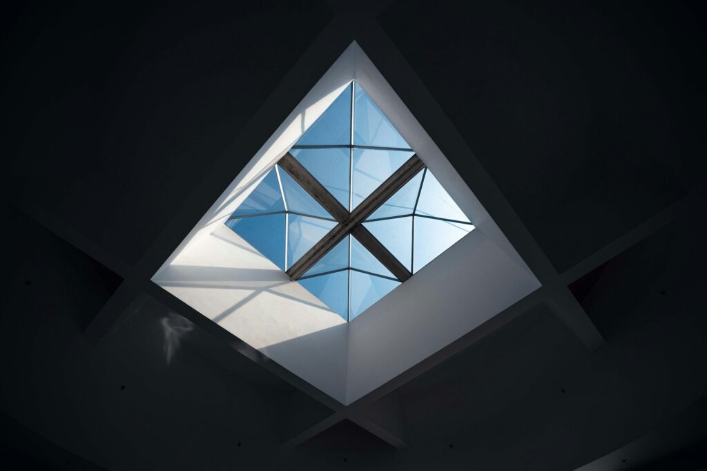 Geometric skylight with bright blue sky visible