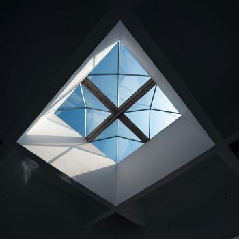 Geometric skylight with bright blue sky visible